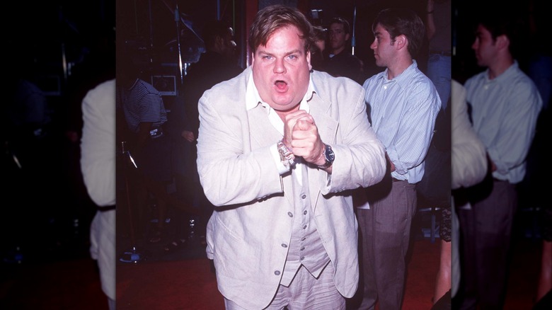 Chris Farley striking a pose on the red carpet