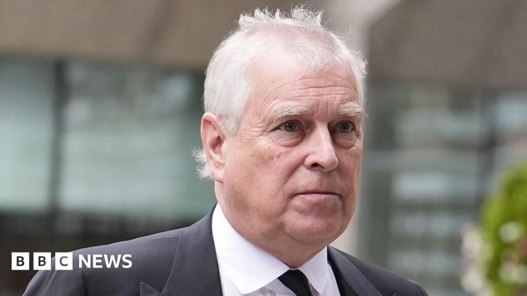 Andrew Mountbatten-Windsor is seen in a black suit.