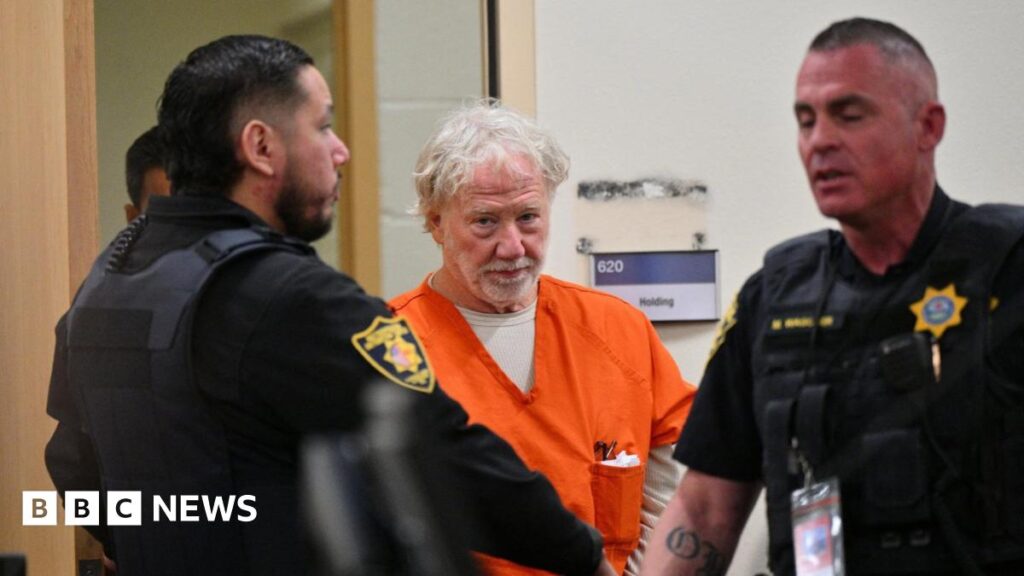 Actor Timothy Busfield wears an orange jail attire and looks on as he is seated in a New Mexico courtroom during a pretrial hearing on 20 January 2026.
