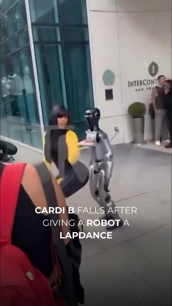 Cardi B falls over giving a robot a lap dance