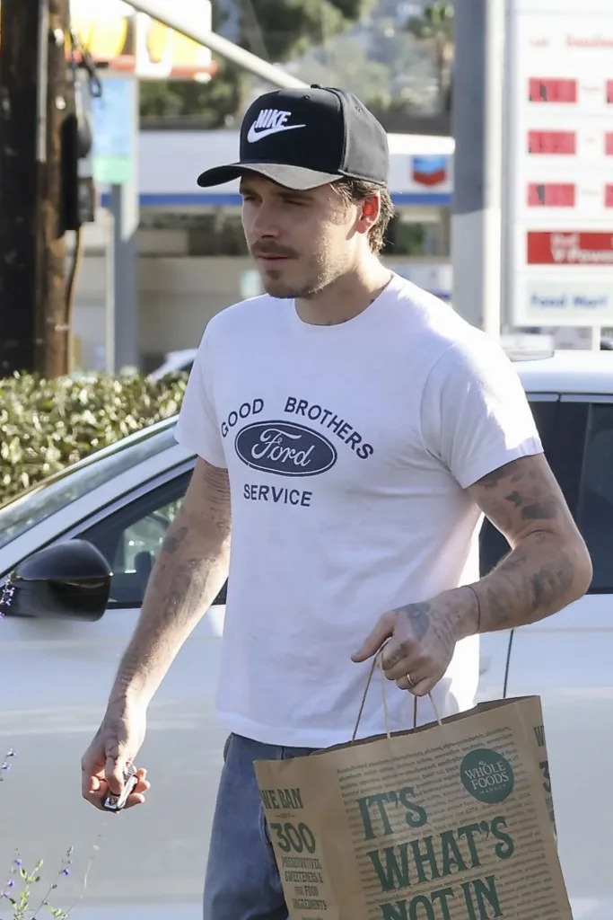 Brooklyn Beckham covered his anchor tattoo dedicated to his father, David Beckham, amid their family feud. Javiles/Bruce / BACKGRID