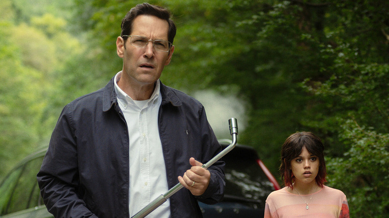 Paul Rudd and Jenna Ortega as Elliot and Ridley Kintner, approaching something cautiously in Death of a Unicorn