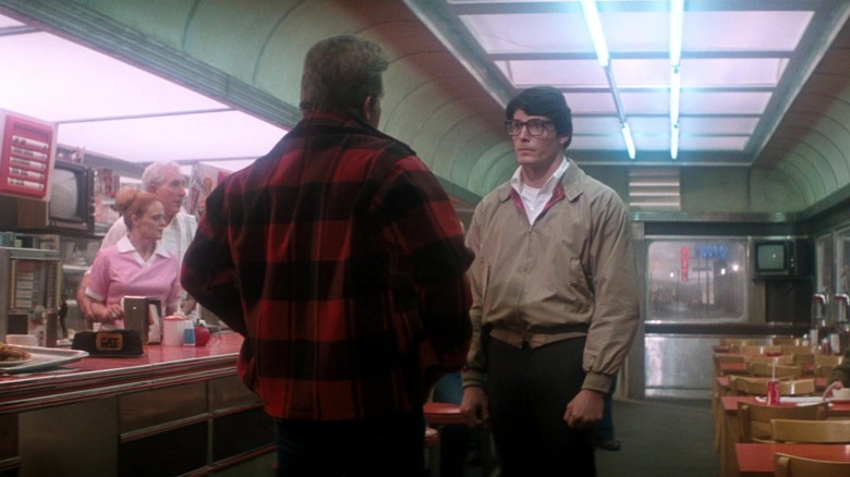 Pepper Martin as Rocky faces off with Christopher Reeve as Clark Kent in Superman II