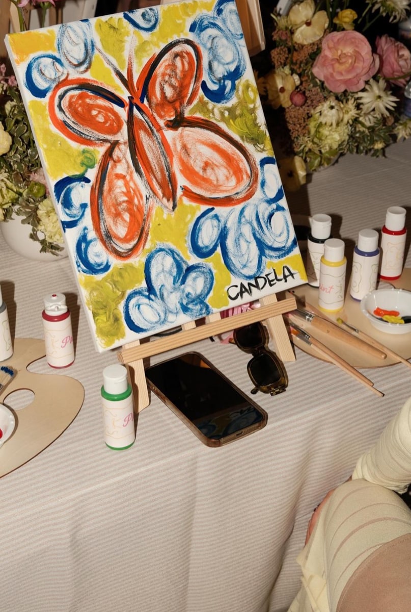 Mini easels and bright paint bottles were set up for a creative break. 
