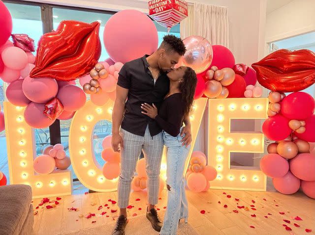 Jonathan Owens and Simone Biles share a kiss on Valentine's Day 2021 Simone Biles/Instagram