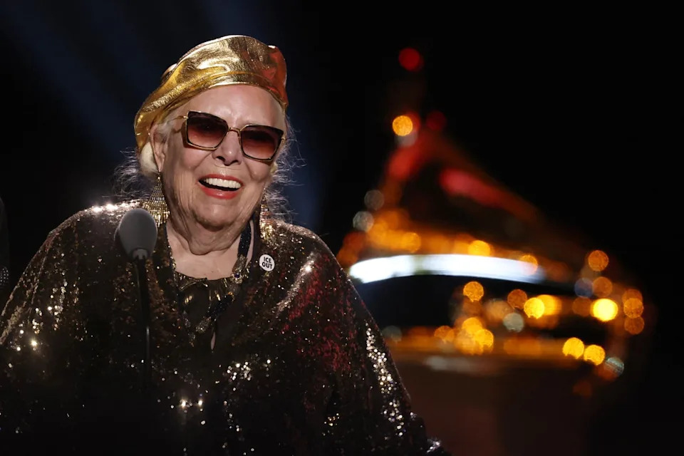 Joni Mitchell wears an 'Ice Out' pin as she accepts the Best Historical Album award at the 68th Annual Grammy Awards (AFP via Getty)