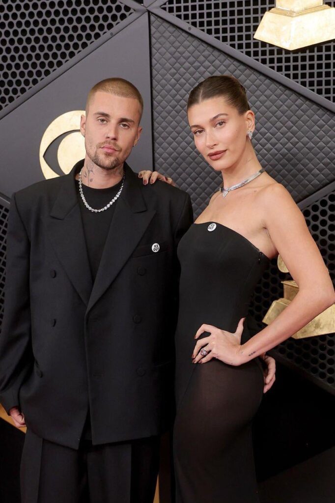 Justin and Hailey Bieber are wearing the ICE OUT pin at the GRAMMYs red carpet tonight.