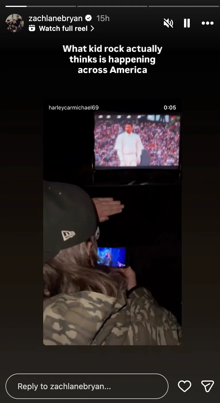 Person recording a TV screen showing someone performing on stage. Text: "What kid rock actually thinks is happening across America."