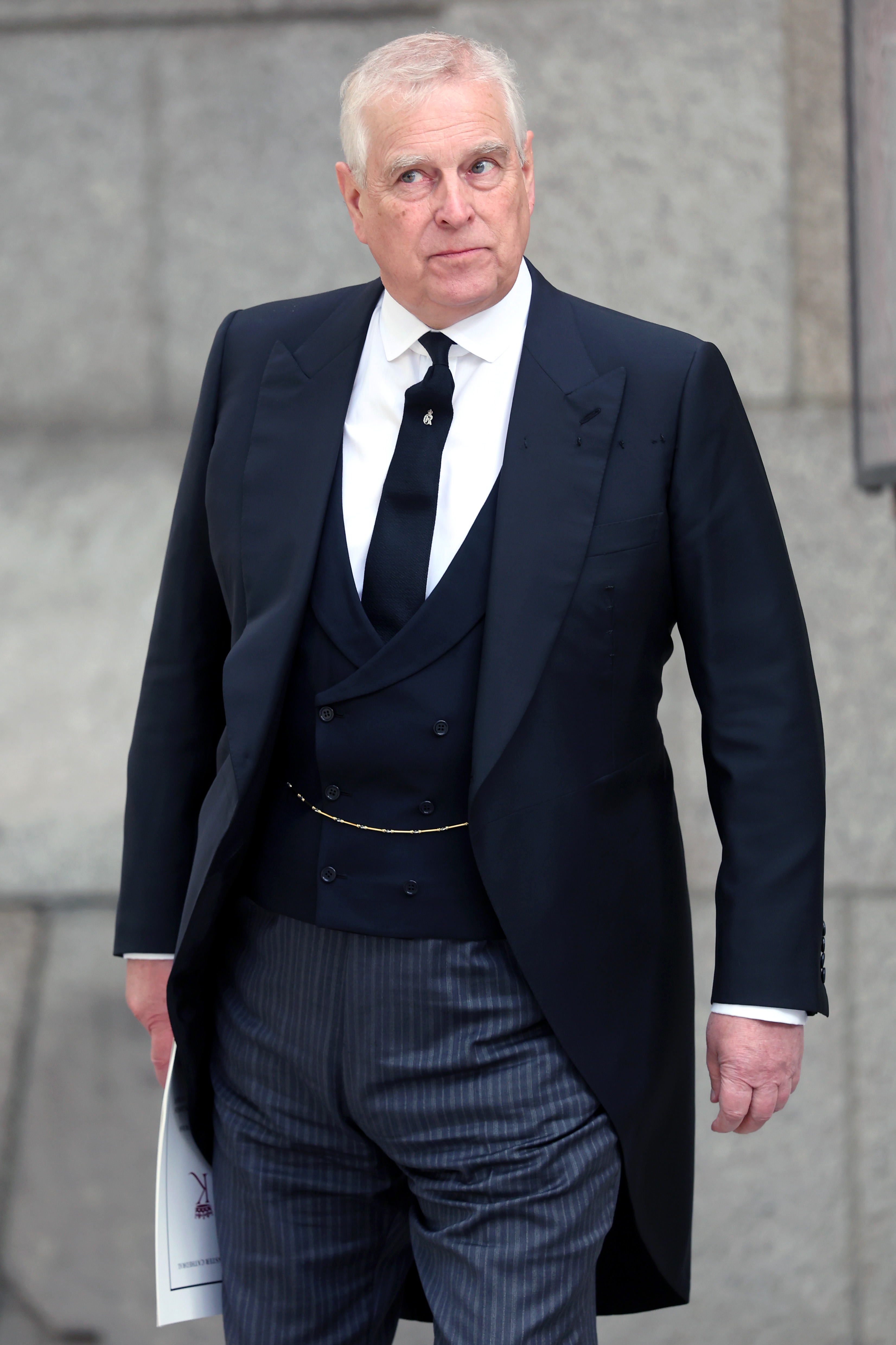 Andrew Mountbatten-Windsor wearing a suit and tie