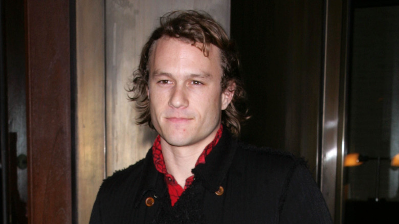 Heath Ledger looking somber in a portrait