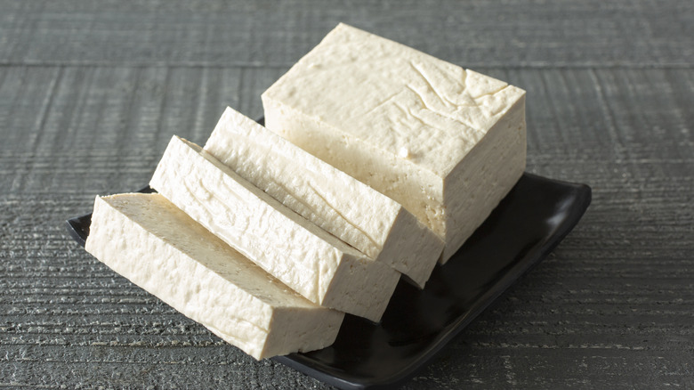 A block of tofu cut into slices