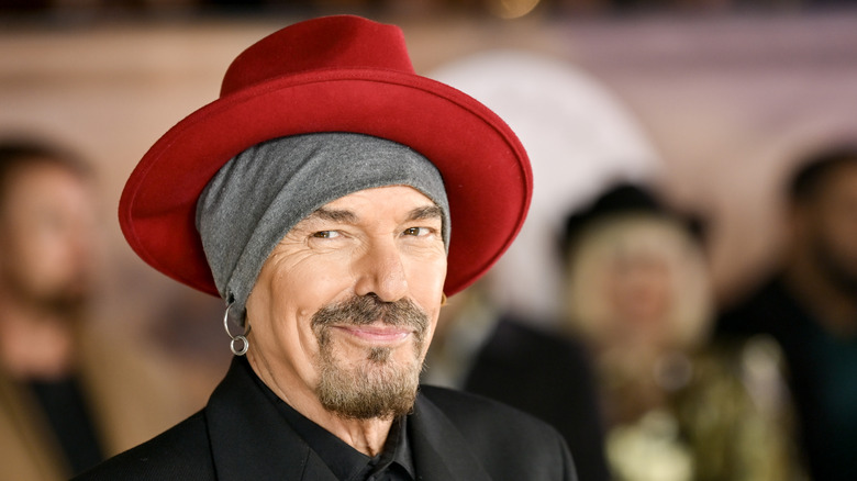 Billy Bob Thornton wearing a red hat