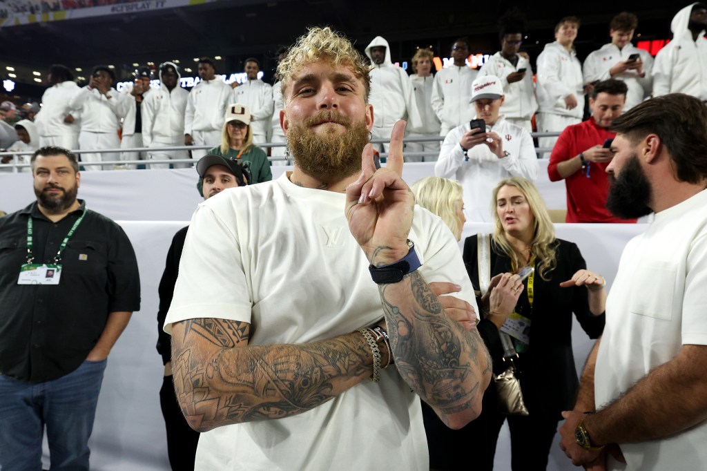 Jake Paul looks on from the sideline prior to a game between the Miami Hurricanes and the Indiana Hoosiers in the 2026 College Football Playoff National Championship at Hard Rock Stadium on January 19, 2026 in Miami Gardens, Florida.  