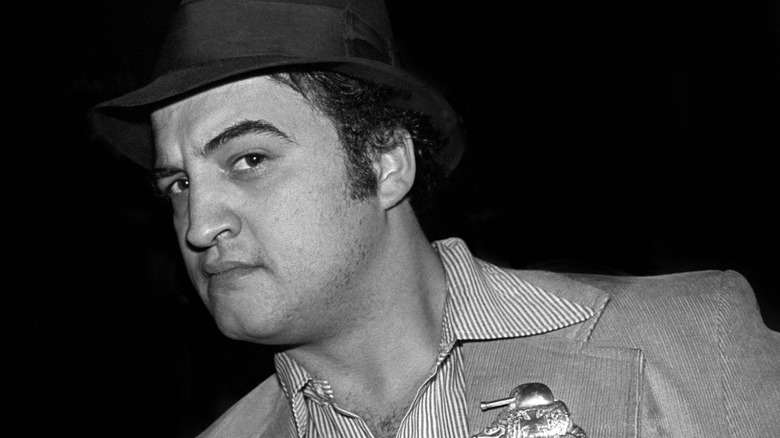 John Belushi striking a pose with a hat circa the late '70s