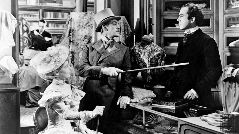 Ascoyne D'Ascoyne pokes Louis Mazzini at his job in Kind Hearts and Coronets