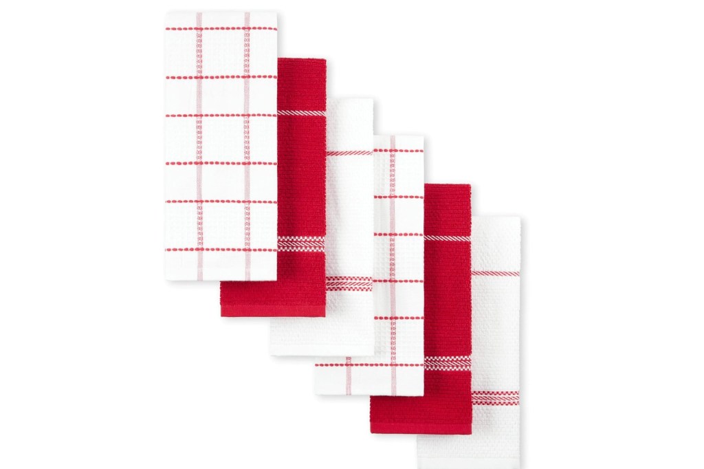 Six red and white kitchen towels.