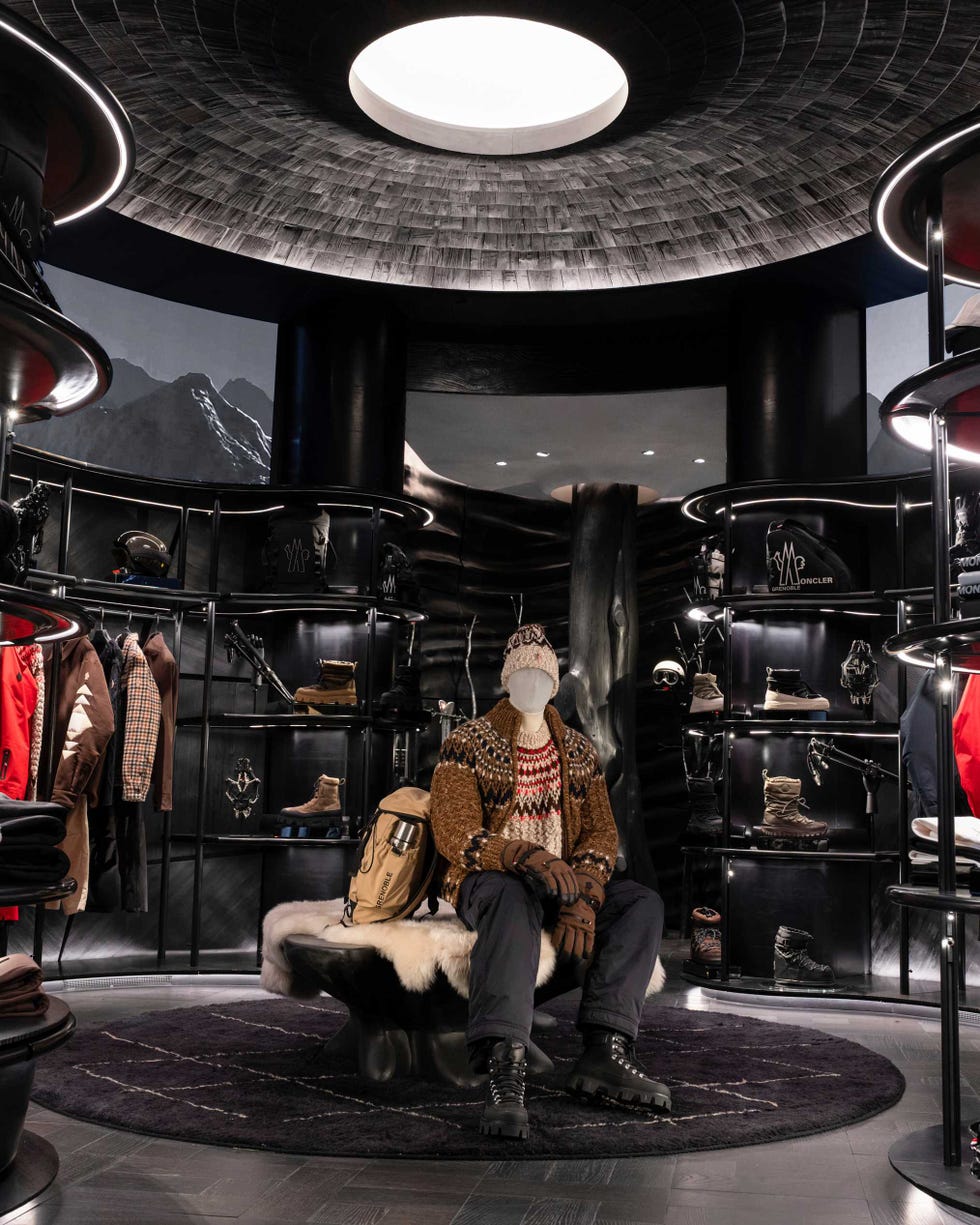 fashion display featuring a mannequin in winter clothing at a retail store