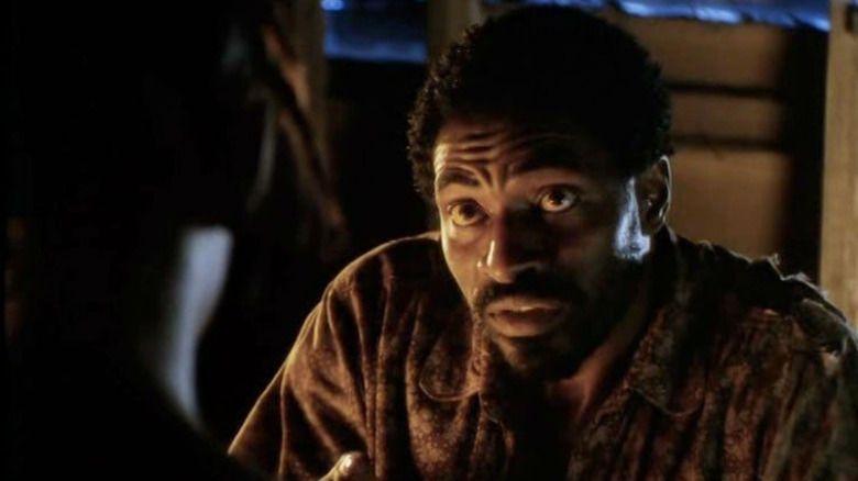 John (Carl Lumbly) looks up while speaking to Sarny (Allison Jones) in Nightjohn