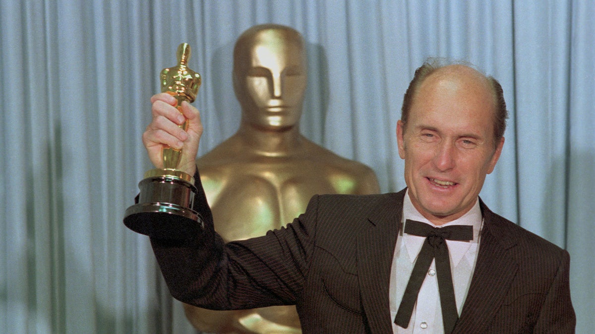 Robert Duvall holds up Academy Award