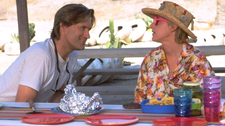 Whitman smiling at Marha in a hat in Mr. Wrong