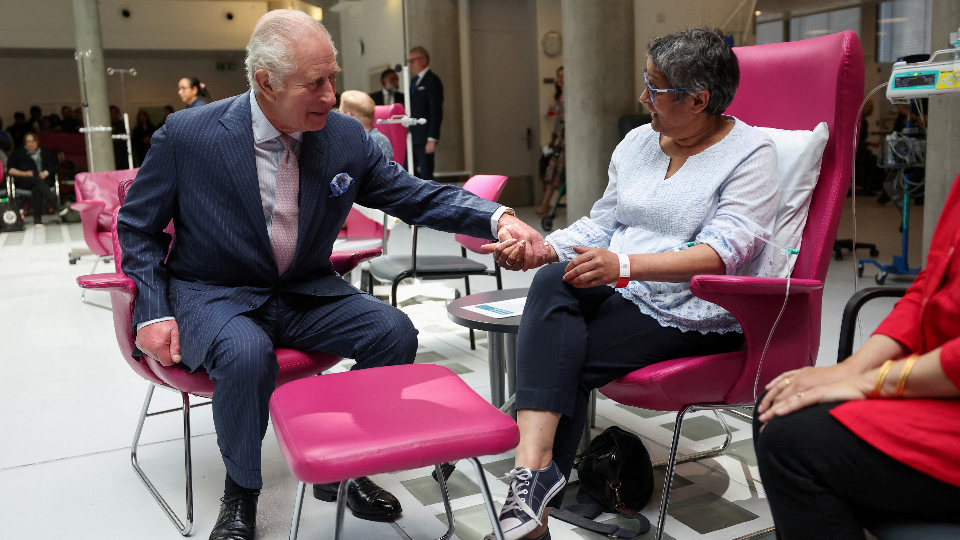 King Charles III meets with patient Asha Millan during a visit to the University College Hospital Macmillan Cancer Centre on April 30, 2024