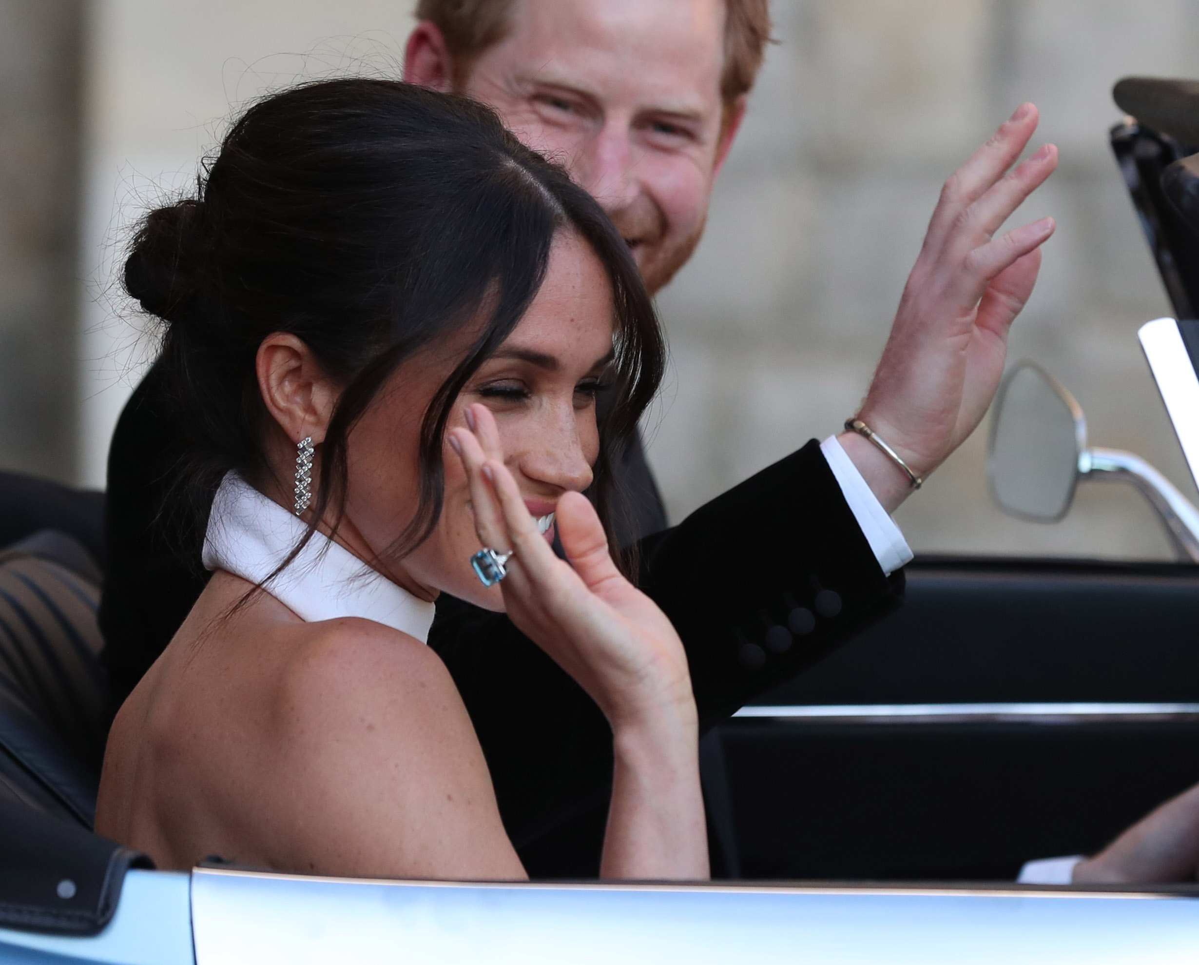 The newly married Duke and Duchess of Sussex, Meghan Markle and Prince Harry, leaving Windsor Castle after their wedding to attend an evening reception at Frogmore House, hosted by the Prince of Wales. The bride wore a ring which belonged to Diana, Princess of Wales.