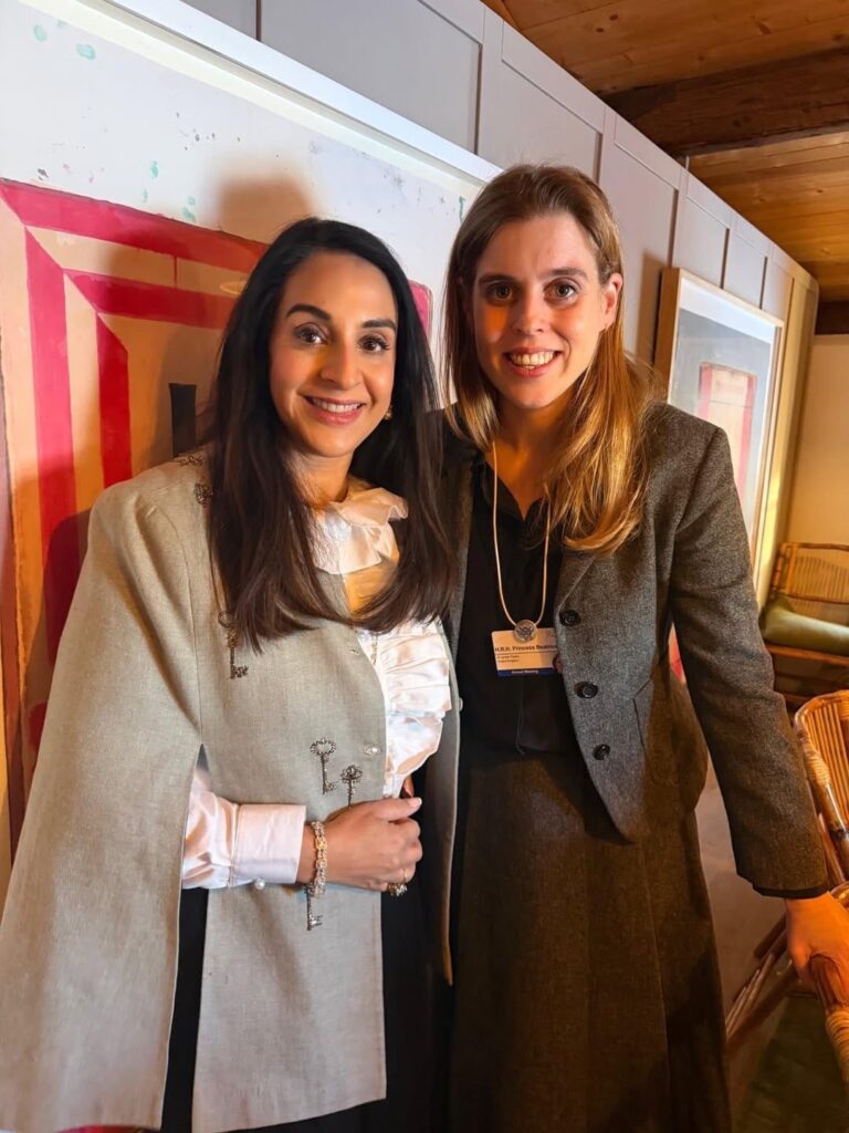 Beatrice rubbing shoulders with Theresa May at World Economic Forum last week