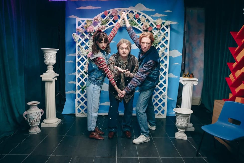 group of people posing together in a decorated setting