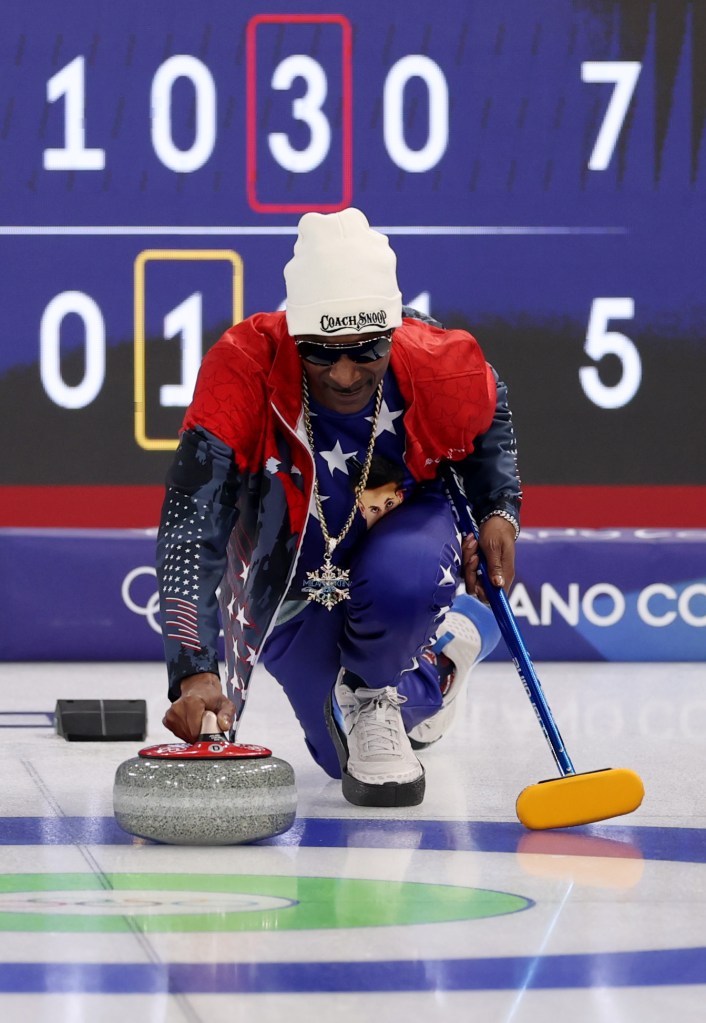 Snoop Dogg, Honorary Coach of Team USA, is seen throwing a stone on the ice following the Curling Mixed Doubles Round Robin match between Team United States and Team Canada on day zero of the Milano Cortina 2026 Winter Olympic games at Cortina Curling Olympic Stadium on February 06, 2026 in Cortina d'Ampezzo, Italy.