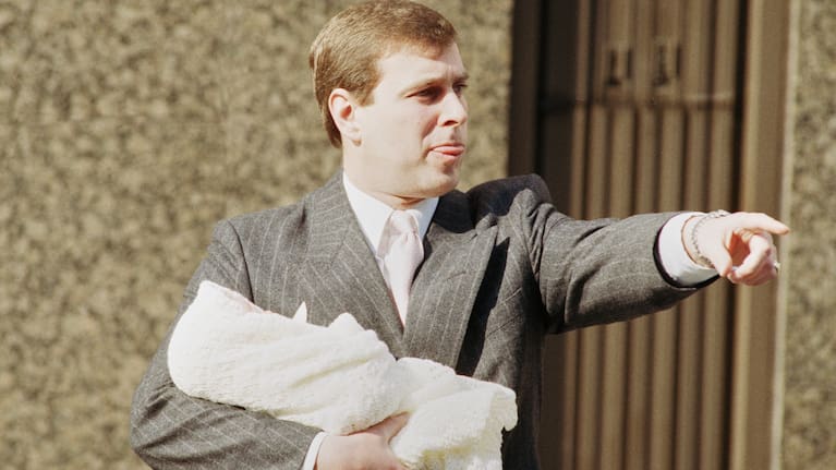 The Duke of York holds week-old Princess Eugenie Victoria Helena outside Portland Hospital in London, March 30, 1990.