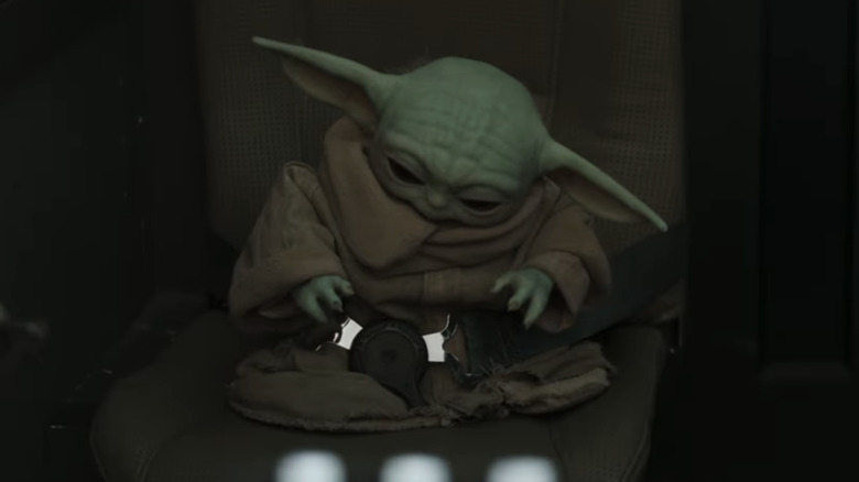 Grogu sad about being reprimanded in the cockpit of the Razor Crest