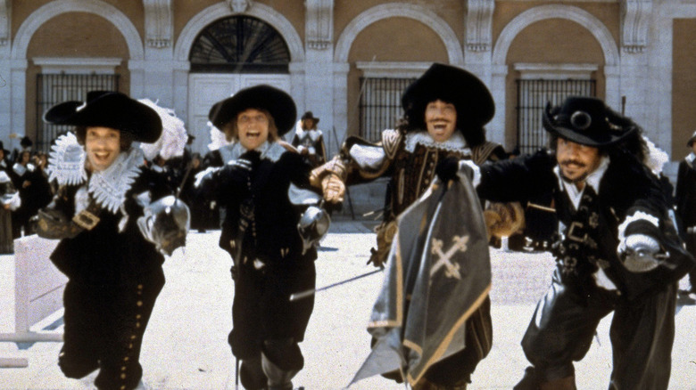 The Three Musketeers and d'Artagnan stand side by side in 1973 film.