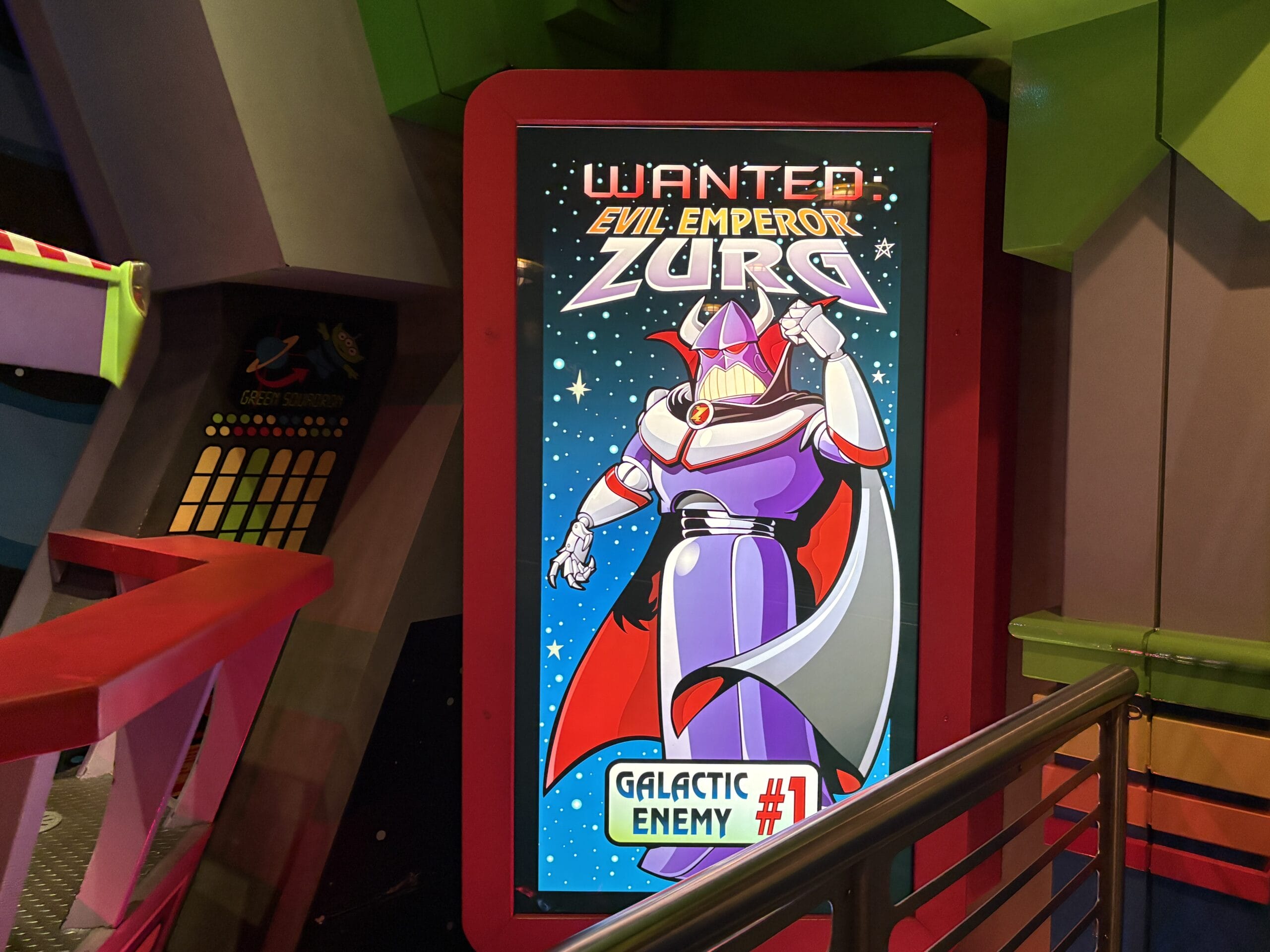 A colorful poster of Evil Emperor Zurg from Buzz Lightyear's Space Ranger Spin in a space-themed "Wanted" setting.
