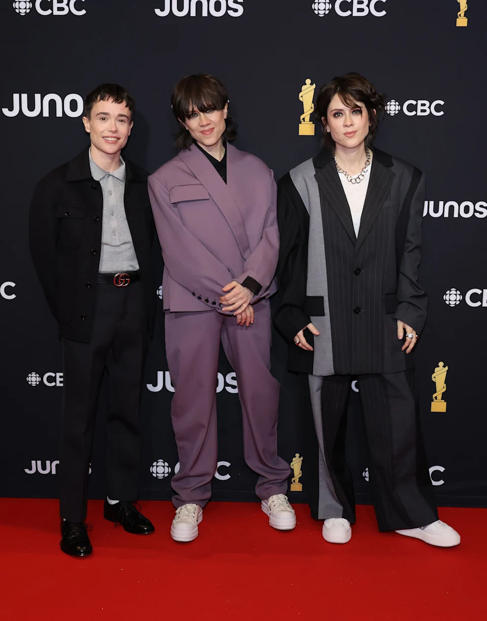 HALIFAX, NOVA SCOTIA - MARCH 24: (L-R) Elliot Page, Sara Quin and Tegan Quin of Tegan and Sara attend the 2024 JUNO Awards at Scotiabank Centre on March 24, 2024 in Halifax, Nova Scotia. (Photo by Cindy Ord/Getty Images)