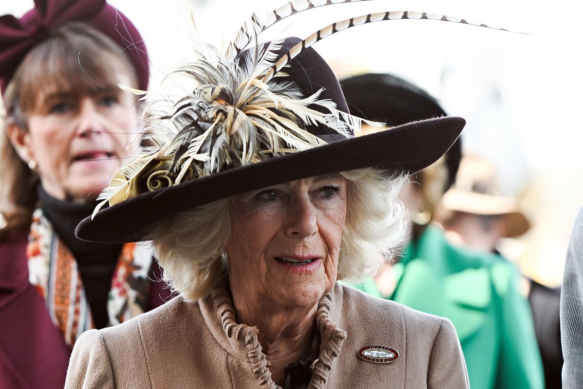 Britain's Queen Camilla reacts as she arrives to attend 'Ladies Day' on the second day of the Cheltenham Festival at Cheltenham Racecourse, in Cheltenham, western England on March 11, 2026.
