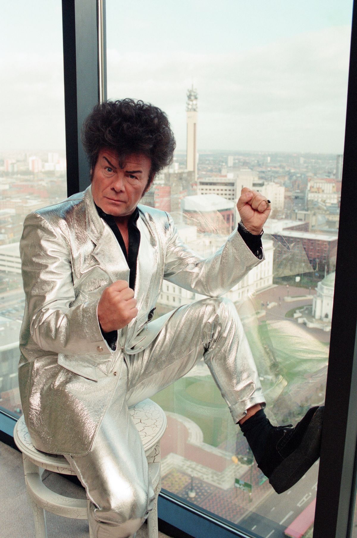 Glitter posing for a photo in 1994