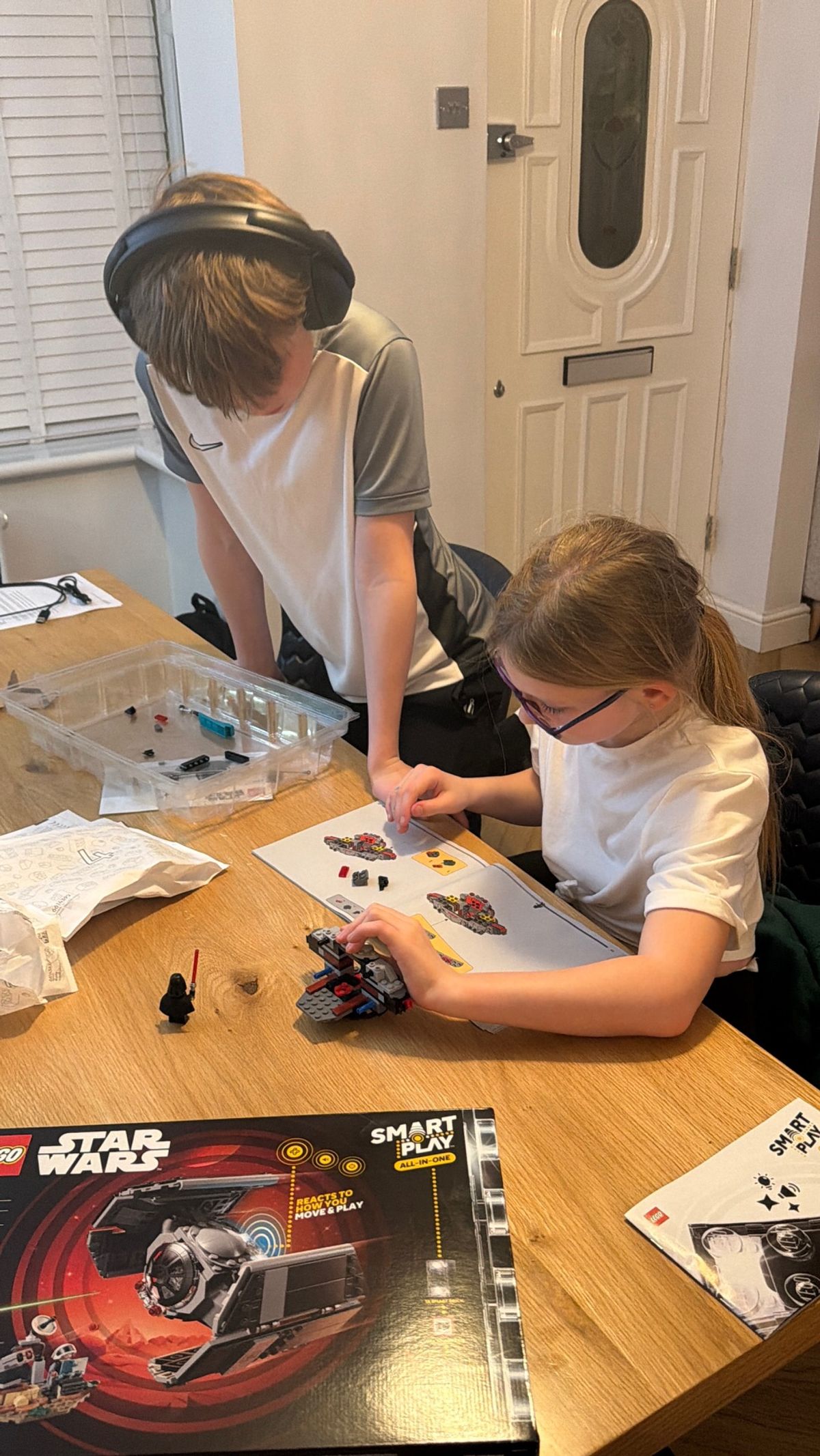 The kids hard at work building the TIE Fighter