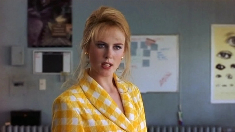 Suzanne Stone in a yellow coat in To Die For