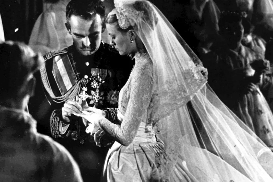 Prince Rainier III and Grace Kelly exchange rings during their wedding ceremony in Monaco on April 19, 1956Credit: Gilbert TOURTE/Gamma-Rapho via Getty