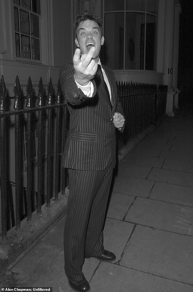 In the age of Instagram, Facebook and Snapchat, it can sometimes be hard to remember a time when social events weren't all documented in real time for the world to see (pictured Robbie Williams)