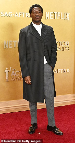 Damson Idris, 34, cut a cool figure in pinstripes as he hit the red carpet