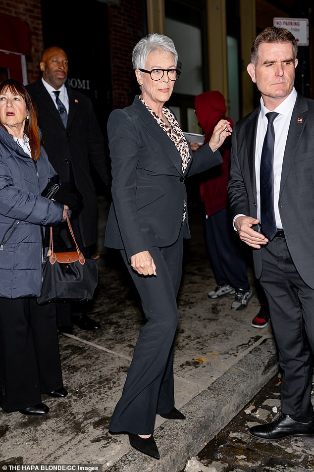 Curtis, 67, also opted for a slim black pantsuit, which she paired with a leopard-print blouse and black pumps