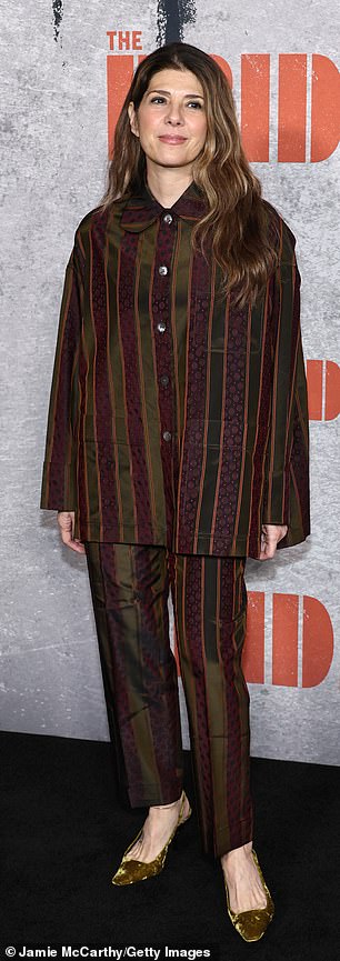 Tomei easily defied her 61 years in a PJ-inspired, striped button-up blouse, matching trousers and olive suede heels