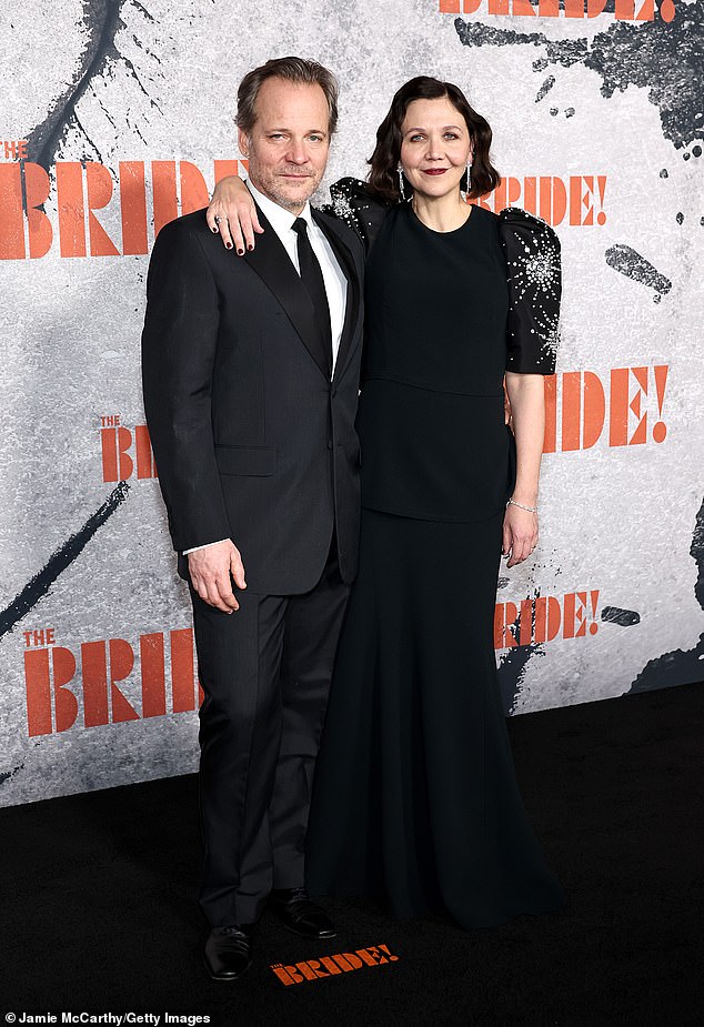 Gyllenhaal made sure to pose with her real-life leading man, husband Peter Sarsgaard (L), who portrays Detective Jake Wiles in The Bride