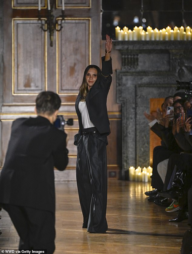 The video comes as Victoria was supported by her husband David and children Romeo, Cruz and Harper at her Paris Fashion Week show on Friday evening