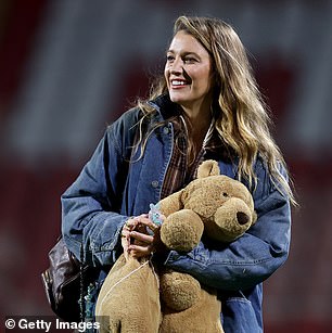 She was stylishly casual for the big game while donning a pair of light blue jeans as well as a matching denim jacket