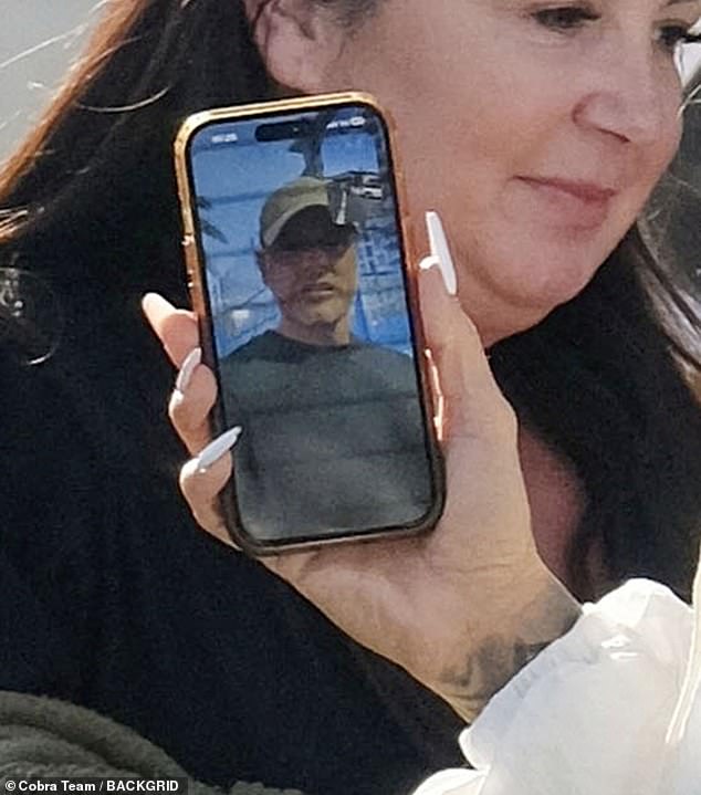 The star, 47, stayed connected with Lee, 41, video calling her husband as she strolled through the airport