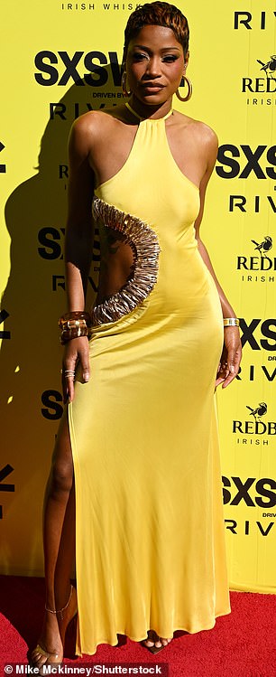 Emphasizing her luminous complexion with makeup, she accessorized with hoops and bracelets, bringing the look together with a towering set of heels