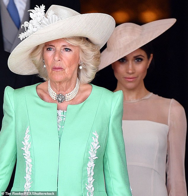 Queen Camilla and Meghan Markle in May 2018. In a dramatic account of the breakdown in relations, author Tom Bower claims tensions between the Queen and the Duchess of Sussex were already spiralling just weeks after Harry and Meghan returned from their honeymoon in the summer of 2018