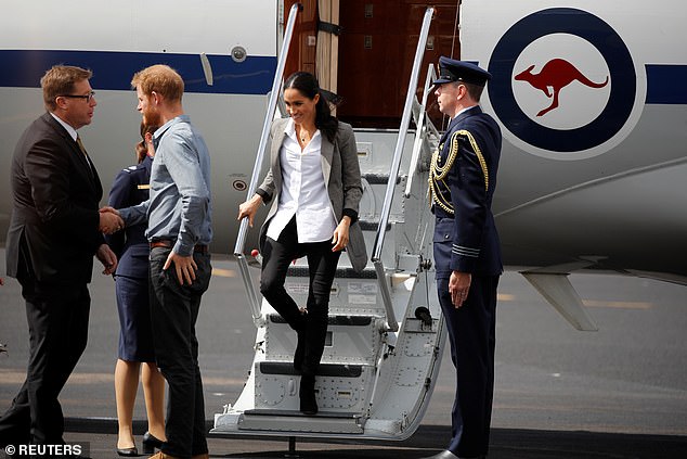 Harry and his wife Meghan arrive at Dubbo airport in October 2018. Their exit from the Royal Family came in early 2020